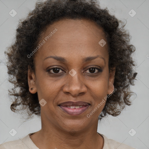 Joyful black adult female with short  brown hair and brown eyes