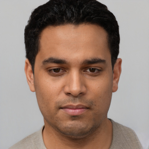 Neutral latino young-adult male with short  black hair and brown eyes