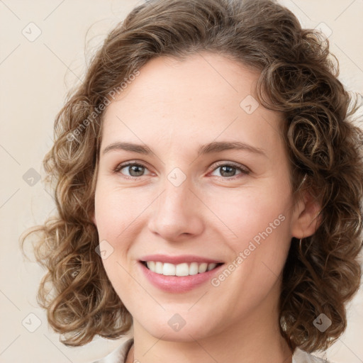 Joyful white young-adult female with medium  brown hair and green eyes