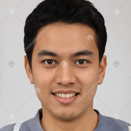 Joyful latino young-adult male with short  black hair and brown eyes