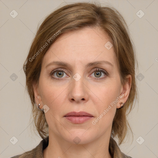 Joyful white adult female with medium  brown hair and grey eyes