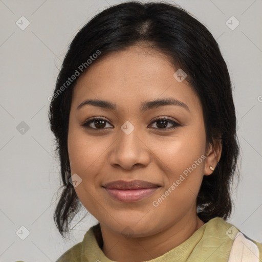 Joyful latino young-adult female with medium  brown hair and brown eyes