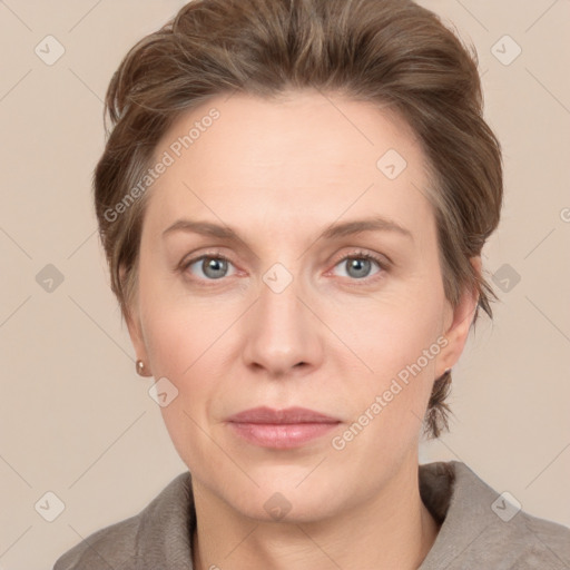 Joyful white adult female with short  brown hair and grey eyes