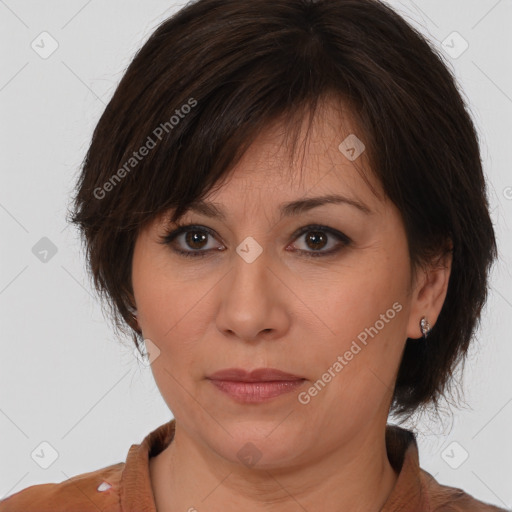 Joyful white adult female with medium  brown hair and brown eyes