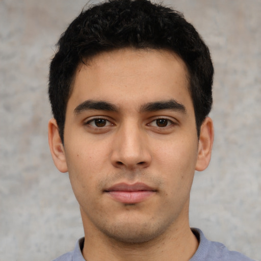 Neutral white young-adult male with short  black hair and brown eyes