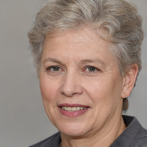 Joyful white middle-aged female with medium  brown hair and brown eyes