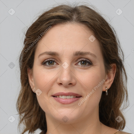 Joyful white young-adult female with medium  brown hair and green eyes