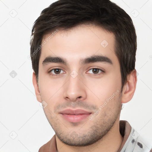 Neutral white young-adult male with short  brown hair and brown eyes