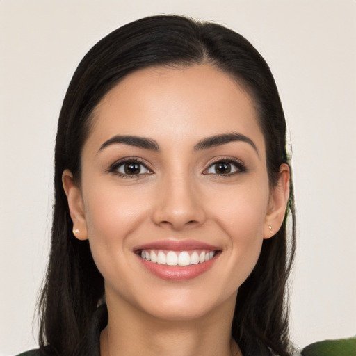 Joyful white young-adult female with long  black hair and brown eyes