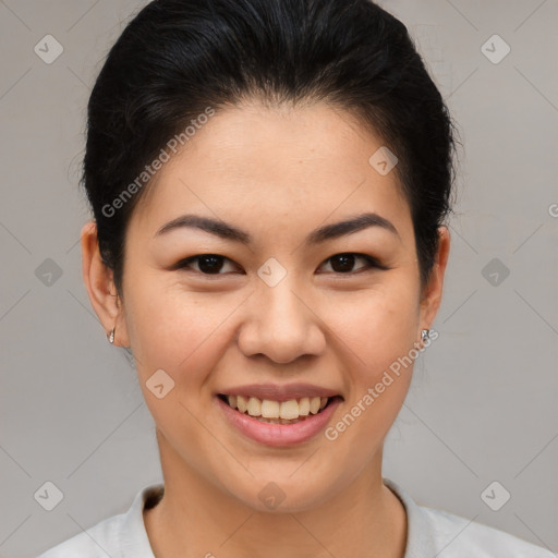 Joyful asian young-adult female with short  brown hair and brown eyes