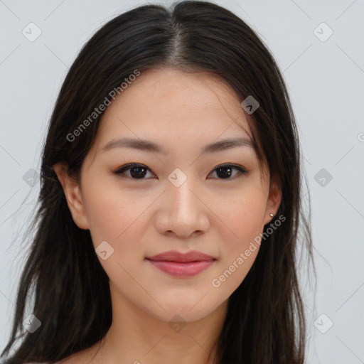 Joyful asian young-adult female with long  brown hair and brown eyes