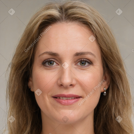 Joyful white adult female with long  brown hair and brown eyes