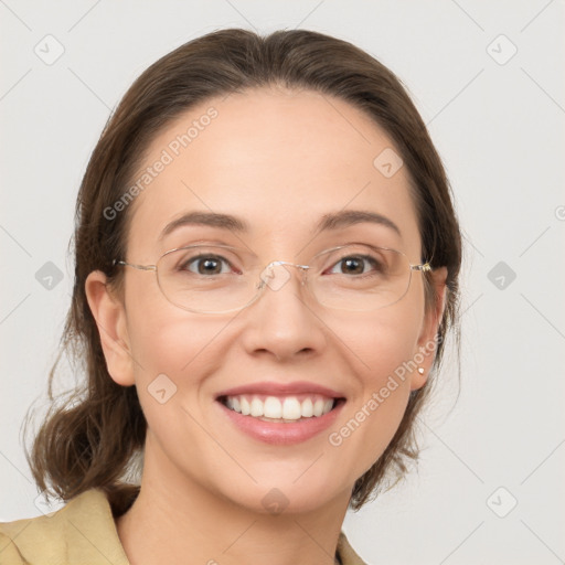 Joyful white adult female with medium  brown hair and grey eyes