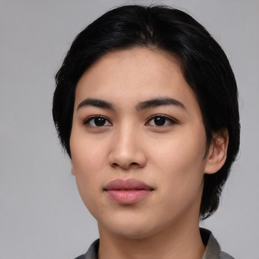 Neutral asian young-adult female with medium  black hair and brown eyes