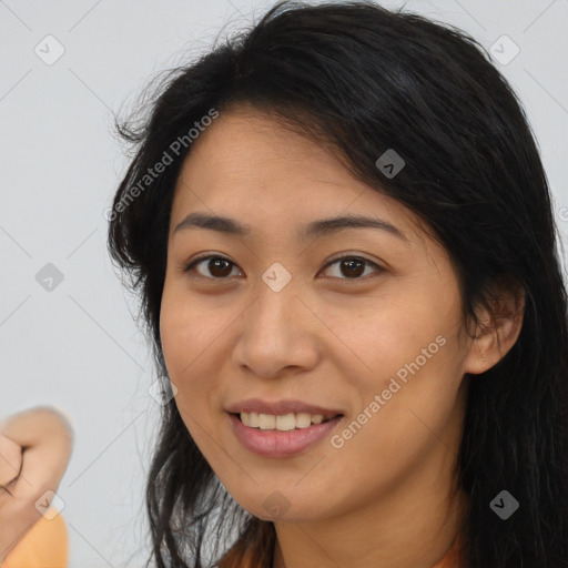 Joyful latino young-adult female with medium  brown hair and brown eyes