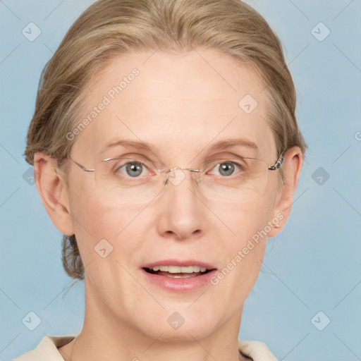 Joyful white adult female with medium  brown hair and blue eyes