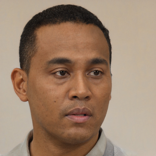 Neutral black young-adult male with short  brown hair and brown eyes