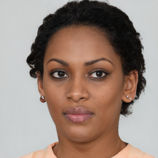 Neutral black young-adult female with short  black hair and brown eyes