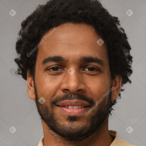 Joyful black young-adult male with short  brown hair and brown eyes