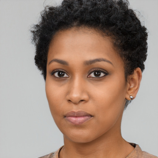 Neutral black young-adult female with short  brown hair and brown eyes