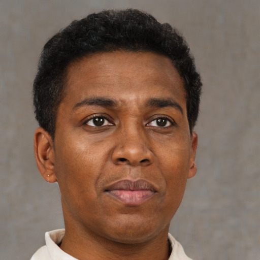 Neutral black young-adult male with short  brown hair and brown eyes