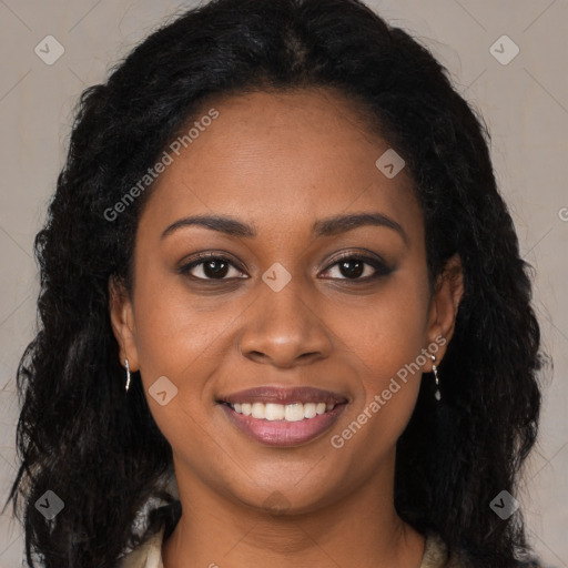 Joyful black young-adult female with long  brown hair and brown eyes