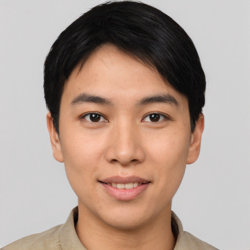 Joyful asian young-adult male with short  black hair and brown eyes