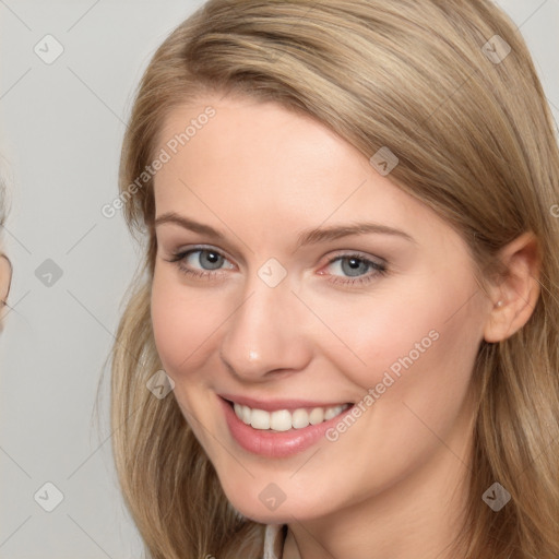 Joyful white young-adult female with long  brown hair and grey eyes