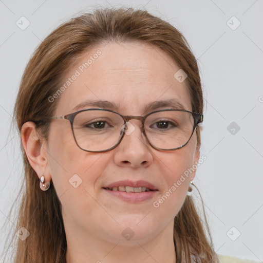 Joyful white adult female with long  brown hair and grey eyes