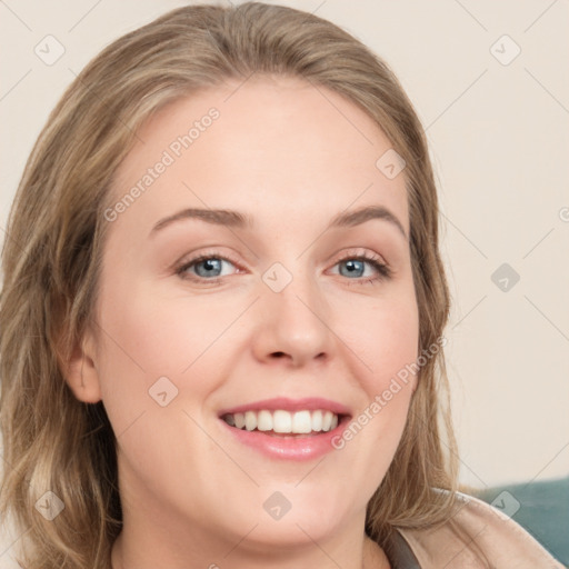 Joyful white young-adult female with medium  brown hair and blue eyes