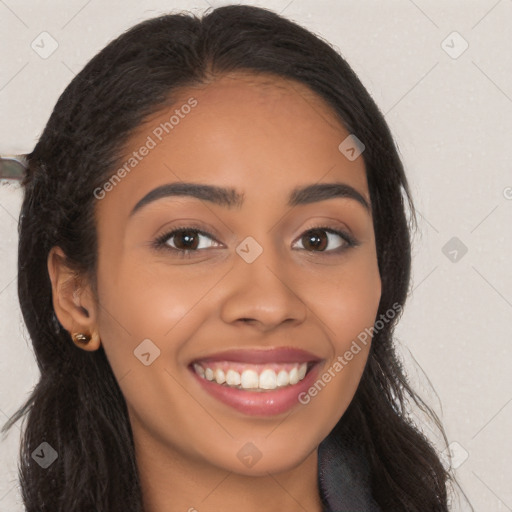 Joyful latino young-adult female with long  brown hair and brown eyes