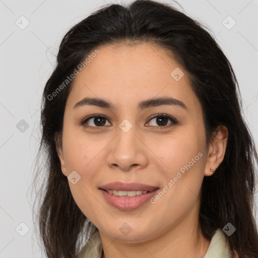 Joyful latino young-adult female with long  brown hair and brown eyes