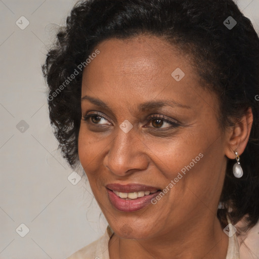 Joyful black adult female with medium  brown hair and brown eyes