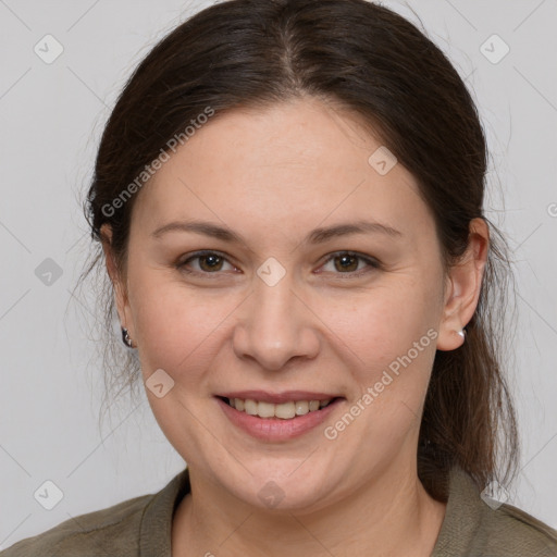 Joyful white adult female with medium  brown hair and grey eyes