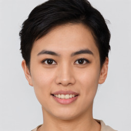 Joyful asian young-adult female with short  brown hair and brown eyes