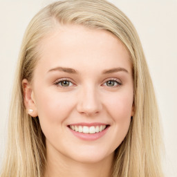 Joyful white young-adult female with long  brown hair and blue eyes