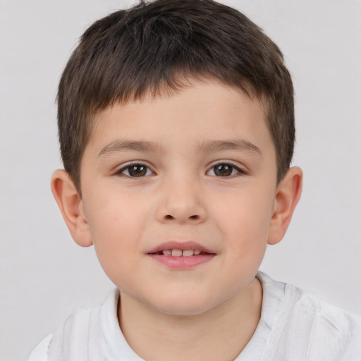 Joyful white child male with short  brown hair and brown eyes