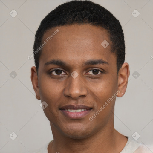 Joyful black young-adult male with short  black hair and brown eyes