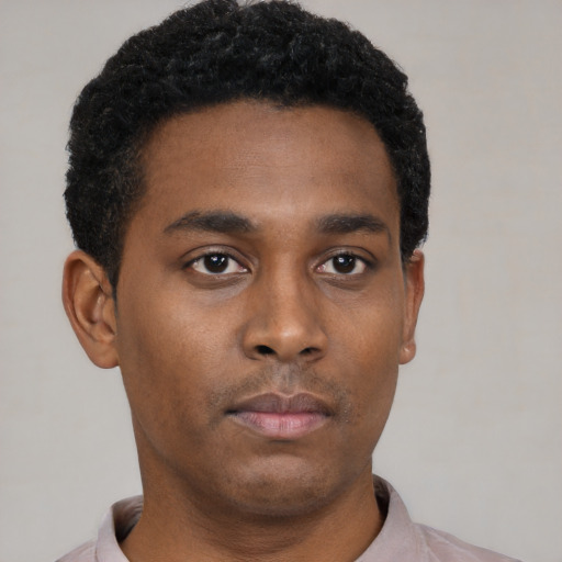 Neutral black young-adult male with short  black hair and brown eyes