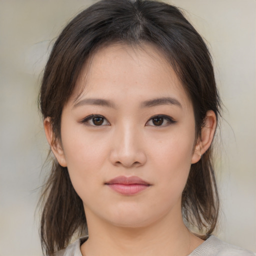 Neutral asian young-adult female with medium  brown hair and brown eyes