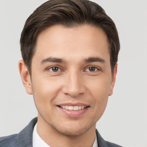 Joyful white young-adult male with short  brown hair and brown eyes