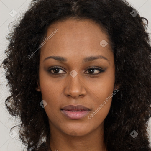 Joyful black young-adult female with long  brown hair and brown eyes