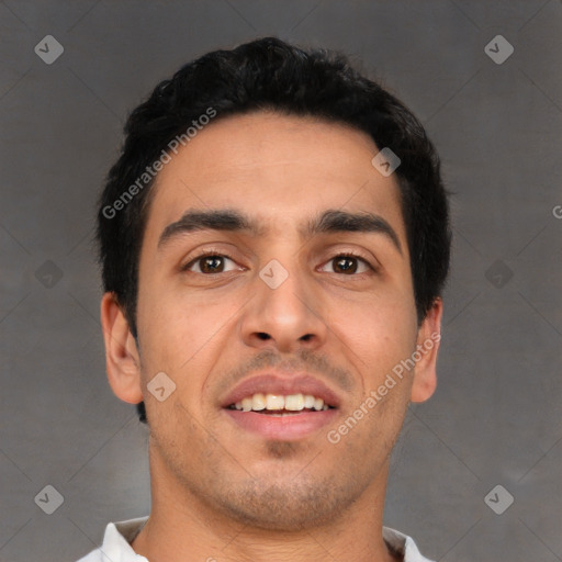 Joyful white young-adult male with short  black hair and brown eyes