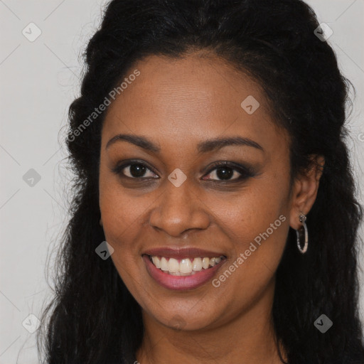 Joyful black young-adult female with long  brown hair and brown eyes