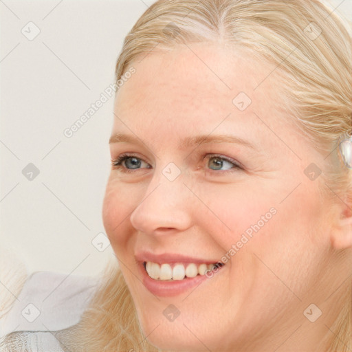 Joyful white young-adult female with medium  brown hair and blue eyes