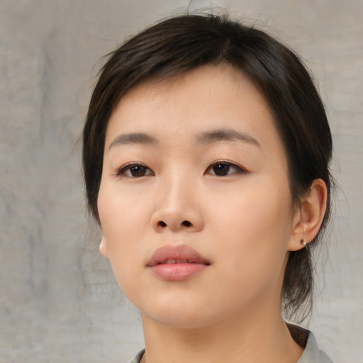Neutral asian young-adult female with medium  brown hair and brown eyes