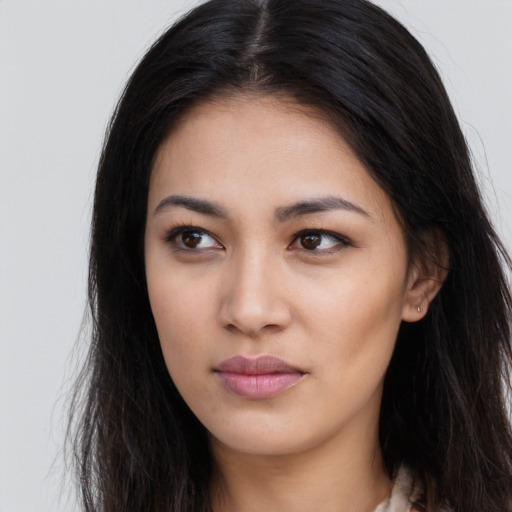 Neutral latino young-adult female with long  brown hair and brown eyes