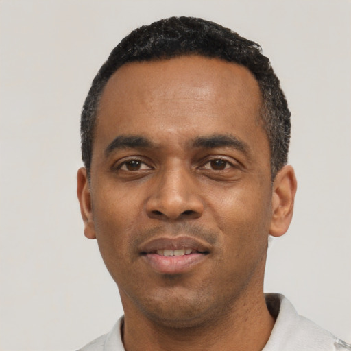 Neutral black young-adult male with short  black hair and brown eyes
