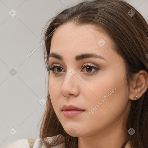 Neutral white young-adult female with long  brown hair and brown eyes