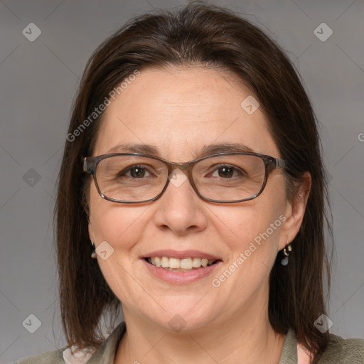 Joyful white adult female with medium  brown hair and grey eyes